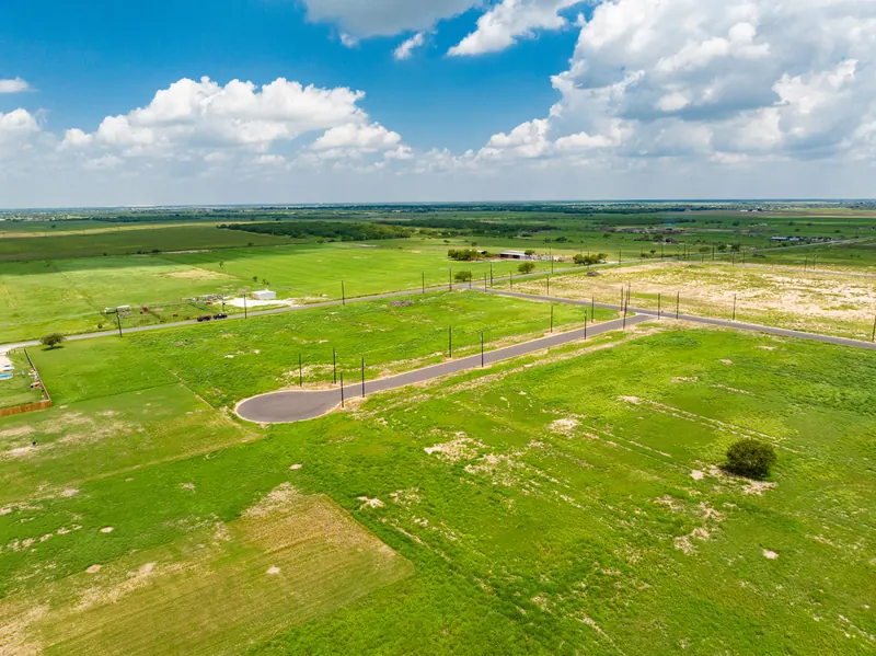 Aerial of a cul-de-sac street with open lots