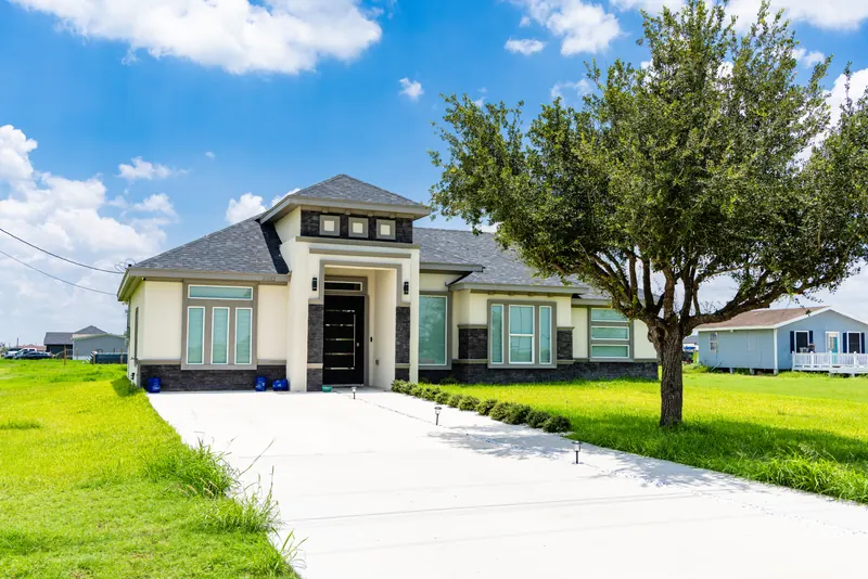 Stone and stucco home built in Vista Ridge Acres