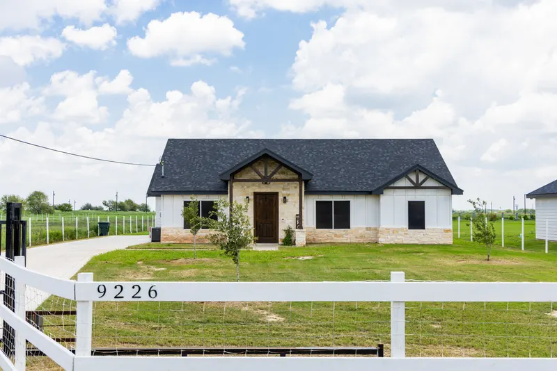 White farmhouse-style home at 9226 in Vista Ridge