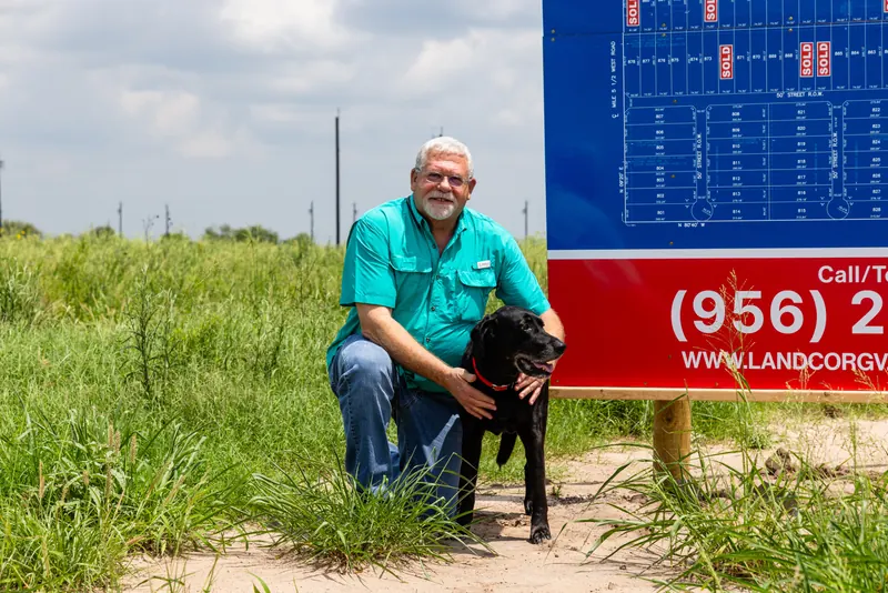 Vista Ridge Acres sign advertising half-acre lots with owner financing